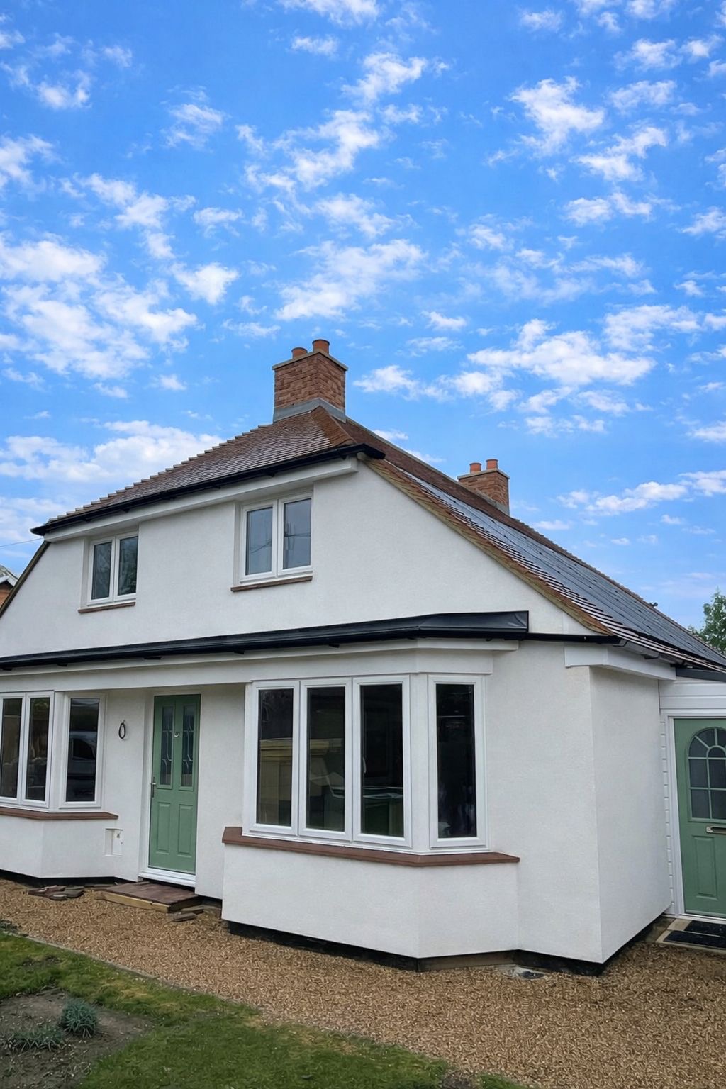 Rendered cottage with solar panels — completed project